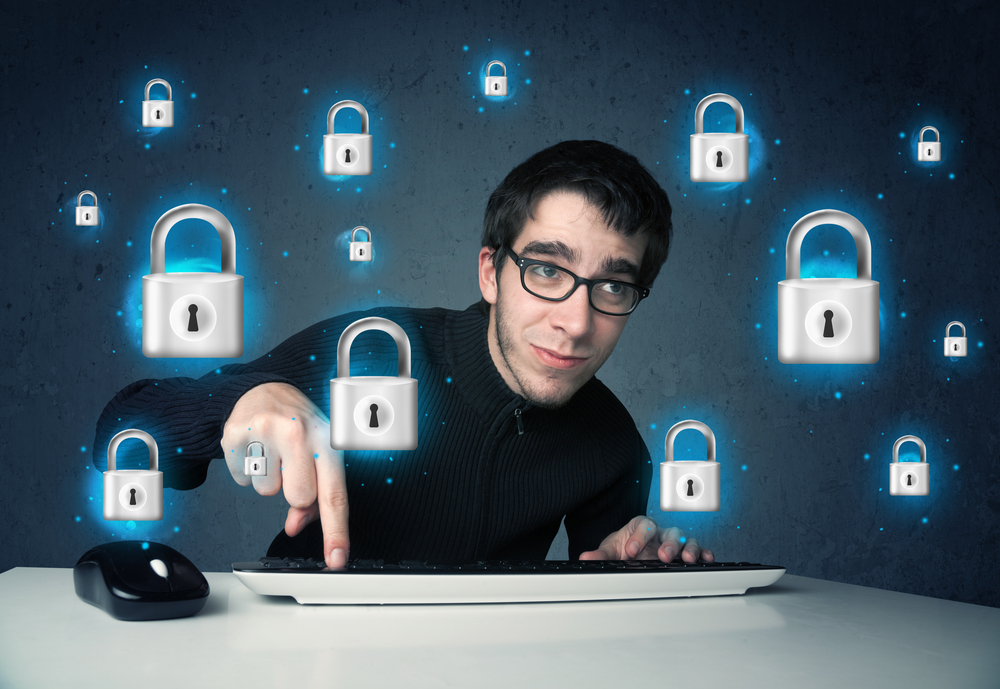 Young hacker with virtual lock symbols and icons on blue background
